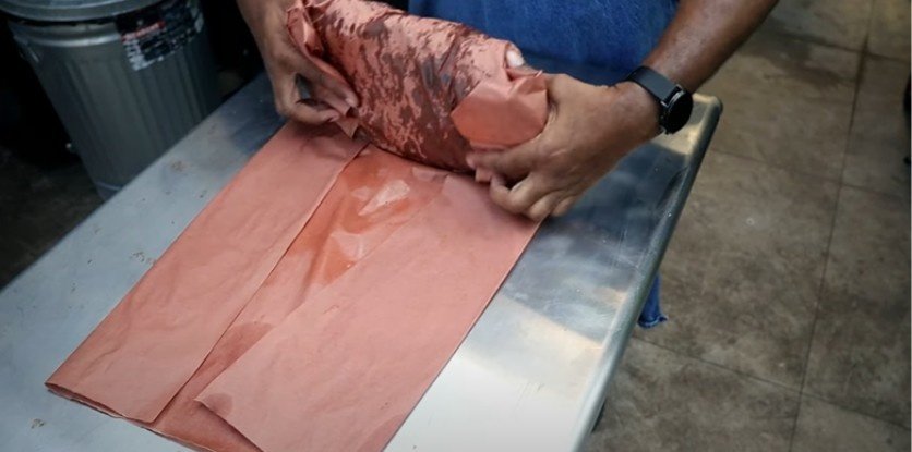 Once you've rolled the brisket a couple of times, give it one last pull to tighten everything up. 